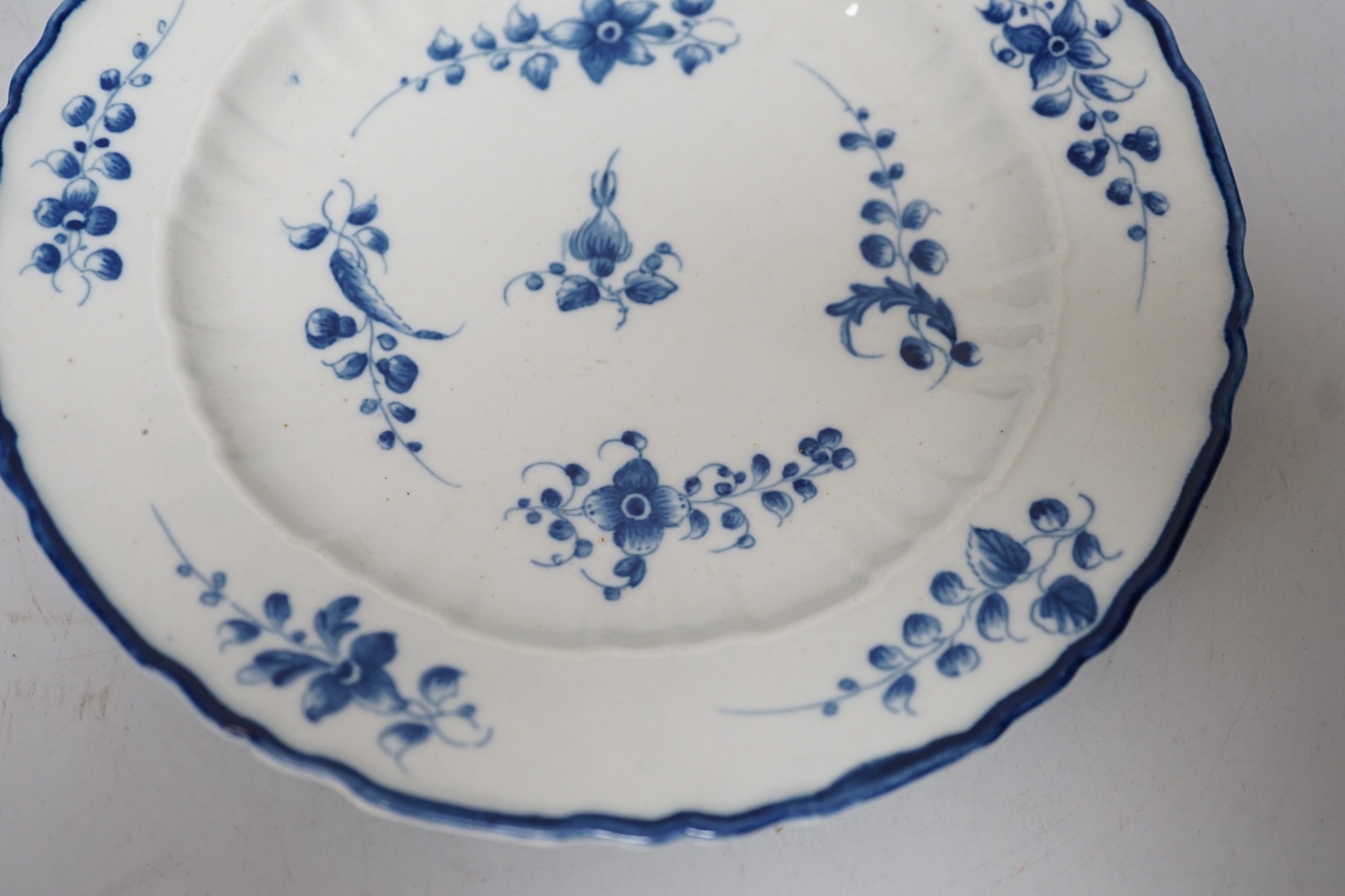 An 18th century Caughley plate painted, with bright, sprigs, impressed mark Salopian, 19.5cms diameter